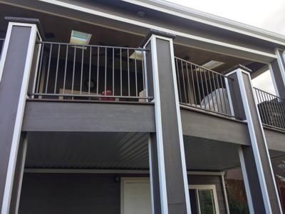 Covered Multi Level Deck with Stairways & Dry Below System with Stairway by Deck Works in Colorado Springs