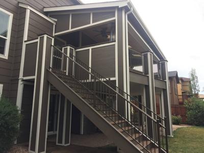 Covered Multi Level Deck with Stairways & Dry Below System with Stairway by Deck Works in Colorado Springs