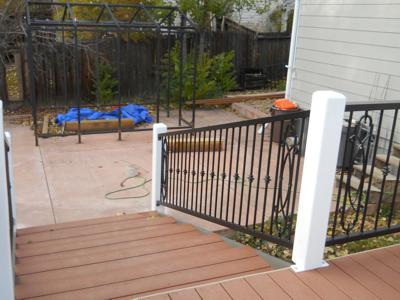 Composite Deck with Stairway & Iron Rails built by Deck Works in Colorado Springs