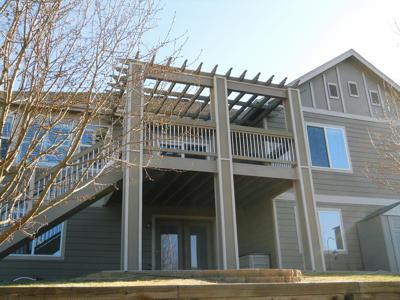 Painted Deck with Pergola, Stairway & Accent Lighting built by Deck Works in Colorado Springs