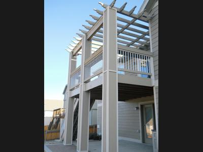 Painted Deck with Pergola, Stairway & Accent Lighting built by Deck Works in Colorado Springs