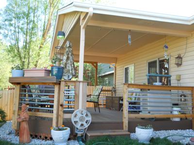 Covered Deck with Custom Rails, Storage Box and Swing built by Deck Works in Colorado Springs