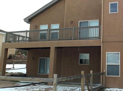 Composite Stucco Deck and Back Stairway by Deck Works in Colorado Springs