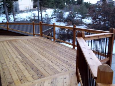 Wrap-Around Hardwood Deck with Stairway by Deck Works in Colorado Springs