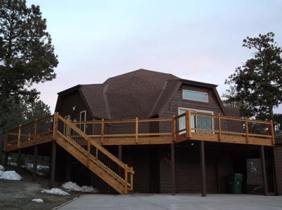 Wrap-Around Hardwood Deck with Stairway by Deck Works in Colorado Springs