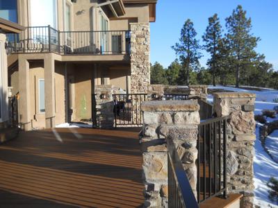 Stucco & Stone Deck with Jacuzzi House by Deck Works in Colorado Springs