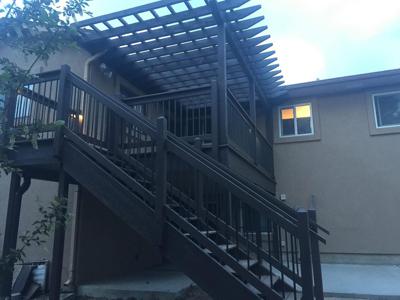 Deck with Pergola, Stairway, Custom Rail & Accent Lighting by Deck Works in Colorado Springs