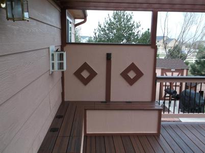 Painted Deck with Pergola, Stairway, Custom Rail, Accent Lighting and Storage Space by Deck Works in Colorado Springs