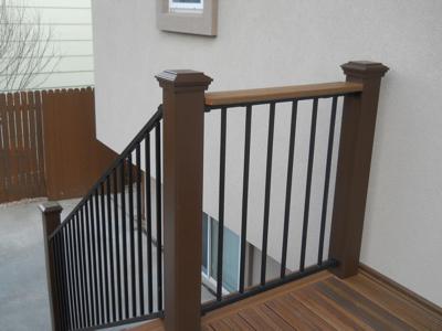 Composite Deck with Iron Rails & Accent Lighting by Deck Works in Colorado Springs