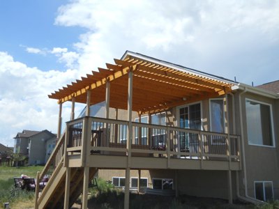 Painted Deck with Pergola, Accent Lighting and Stairway by Deck Works in Colorado Springs