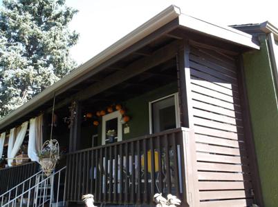 Covered Front Porch with Enclosed Patio built by Deck Works in Colorado Springs