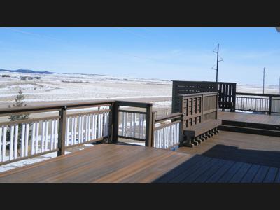 Multi Level Deck with Stairway, Benches, Custom Rail & Accent Lighting built by Deck Works in Colorado Springs