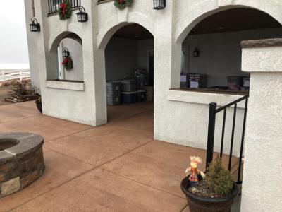 Stucco Deck with Stamped Concrete, Stairway, Lighting & Iron Rail built by Deck Works in Colorado Springs