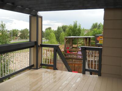 Painted Deck with Custom Rail, Flower Boxes, Stairway & Pergola built by Deck Works in Colorado Springs