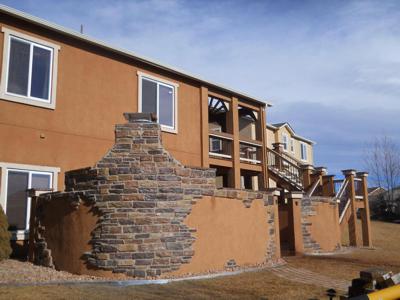 Stucco and Stone Patio by Deck Works in Colorado Springs