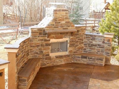 Fireplace with Benches by Deck Works in Colorado Springs