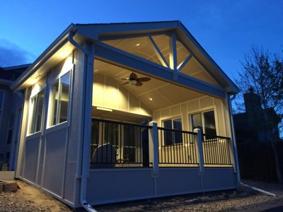 Enclosed Patio with Iron Rails and Lighting by Deck Works in Colorado Springs