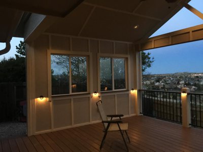 Enclosed Patio with Iron Rails and Lighting by Deck Works in Colorado Springs