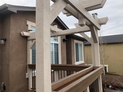 Painted Deck with Stairways, Privacy Screen, Iron Rails & Flower Boxes built by Deck Works in Colorado Springs
