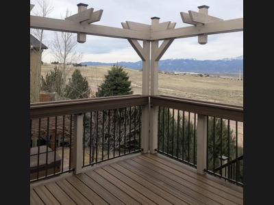 Painted Deck with Stairways, Privacy Screen, Iron Rails & Flower Boxes built by Deck Works in Colorado Springs