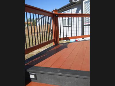 Painted Deck with Concrete Patio, Accent Lighting & Custom Rail built by Deck Works in Colorado Springs