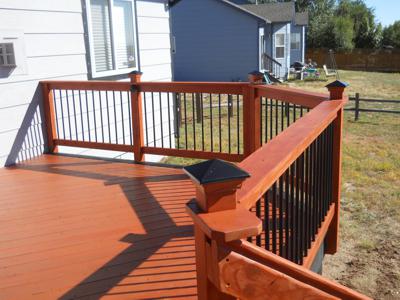 Painted Deck with Concrete Patio, Accent Lighting & Custom Rail built by Deck Works in Colorado Springs