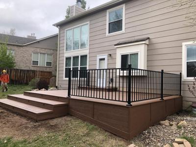 Composite Patio with Iron Rails and Accent Lighting built by Deck Works in Colorado Springs