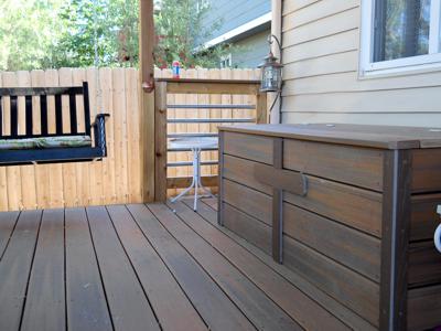 Covered Deck with Custom Rails, Storage Box and Swing built by Deck Works in Colorado Springs