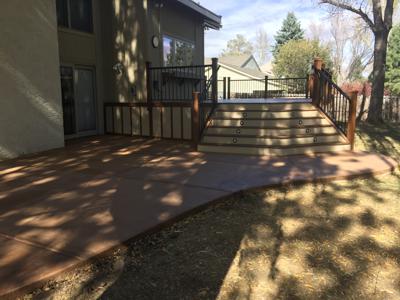Deck With Concrete Patio, Iron Rails & Accent Lighting by Deck Works in Colorado Springs