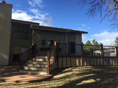 Deck With Concrete Patio, Iron Rails & Accent Lighting by Deck Works in Colorado Springs