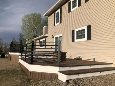 Composite Deck with Iron Rails and Accent Lighting built by Deck Works in Colorado Springs