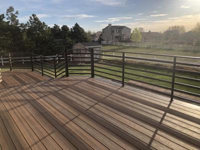Composite Deck with Iron Rails and Accent Lighting built by Deck Works in Colorado Springs