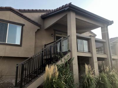 Stucco Deck with Iron Rails, Stairway and Deck Cover built by Deck Works in Colorado Springs