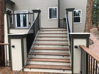 Multilevel Composite Deck with Hot Tub, Accent Lights and Iron Rails built by Deck Works in Colorado Springs