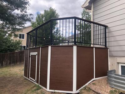 Composite Deck with Iron Rails and Deck Skirt built by Deck Works in Colorado Springs