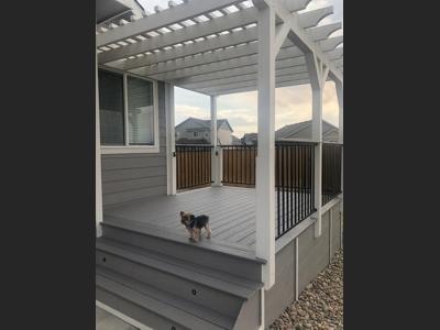 Composite Deck with Iron Rails and Pergola built by Deck Works in Colorado Springs
