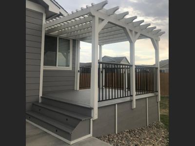 Composite Deck with Iron Rails and Pergola built by Deck Works in Colorado Springs