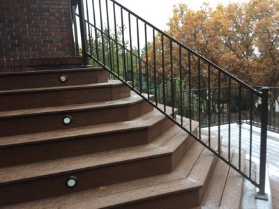 Staircase with Iron Rail & Accent Lighting by Deck Works in Colorado Springs