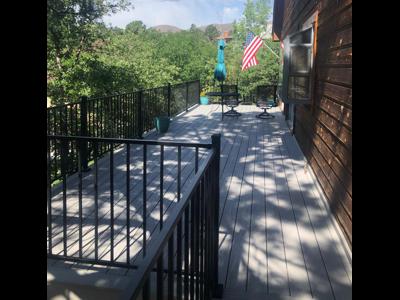 Composite Deck with Iron Rail and Dry Below Deck System built by Deck Works in Colorado Springs