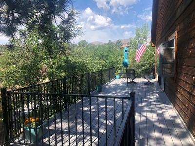 Composite Deck with Iron Rail and Dry Below Deck System built by Deck Works in Colorado Springs