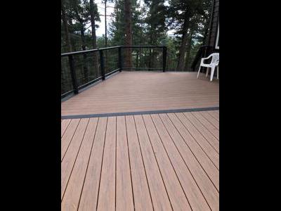 Composite Deck with Ramp, Iron Rail and Accent Lights built by Deck Works in Colorado Springs