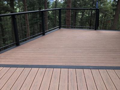 Composite Deck with Ramp, Iron Rail and Accent Lights built by Deck Works in Colorado Springs