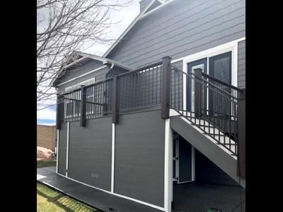 Composite Deck with Iron Rail, Stairways and Storage Space built by Deck Works in Colorado Springs