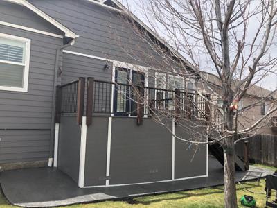 Composite Deck with Iron Rail, Stairways and Storage Space built by Deck Works in Colorado Springs