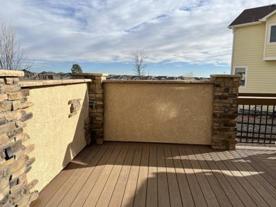 Stucco Deck with Storage, Play House and Extra Room built by Deck Works in Colorado Springs
