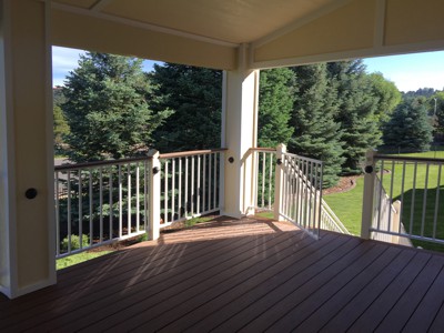 Covered Deck with Stairway, Custom Rail & Accent Lighting by Deck Works in Colorado Springs