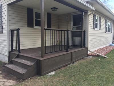 Front & Back Porch with Iron Rail by Deck Works in Colorado Springs