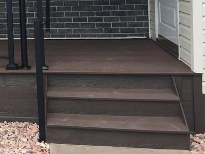 Front & Back Porch with Iron Rail by Deck Works in Colorado Springs
