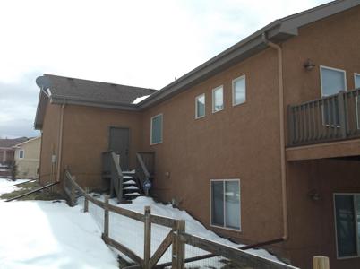 Composite Stucco Deck and Back Stairway by Deck Works in Colorado Springs