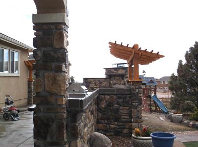 Outdoor Living Space with Cultured Stone by Deck Works in Colorado Springs